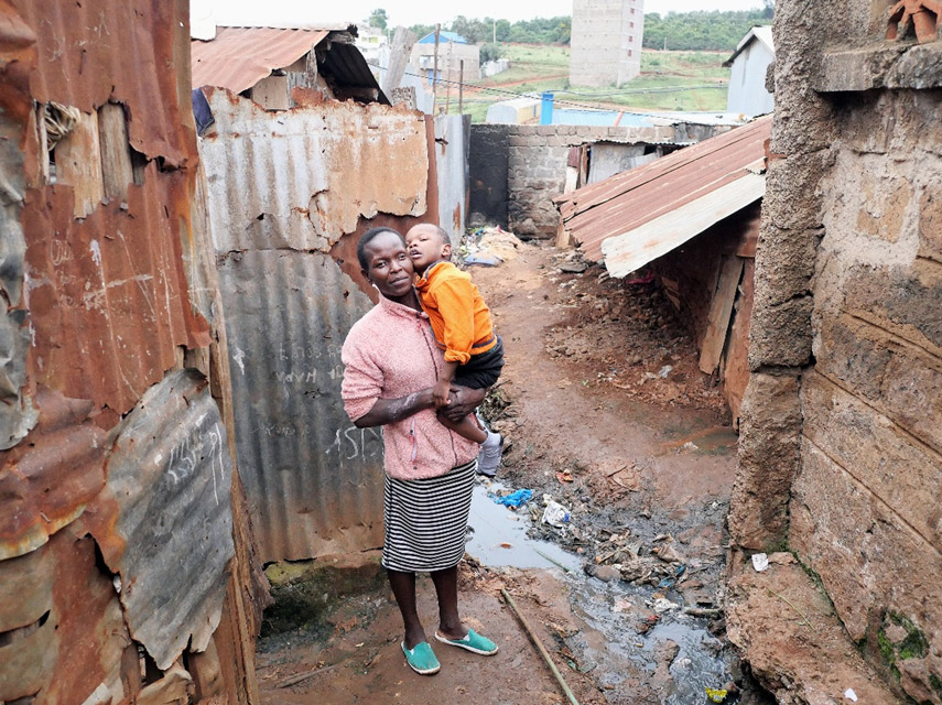 disabled-boy-with-mother-kibera